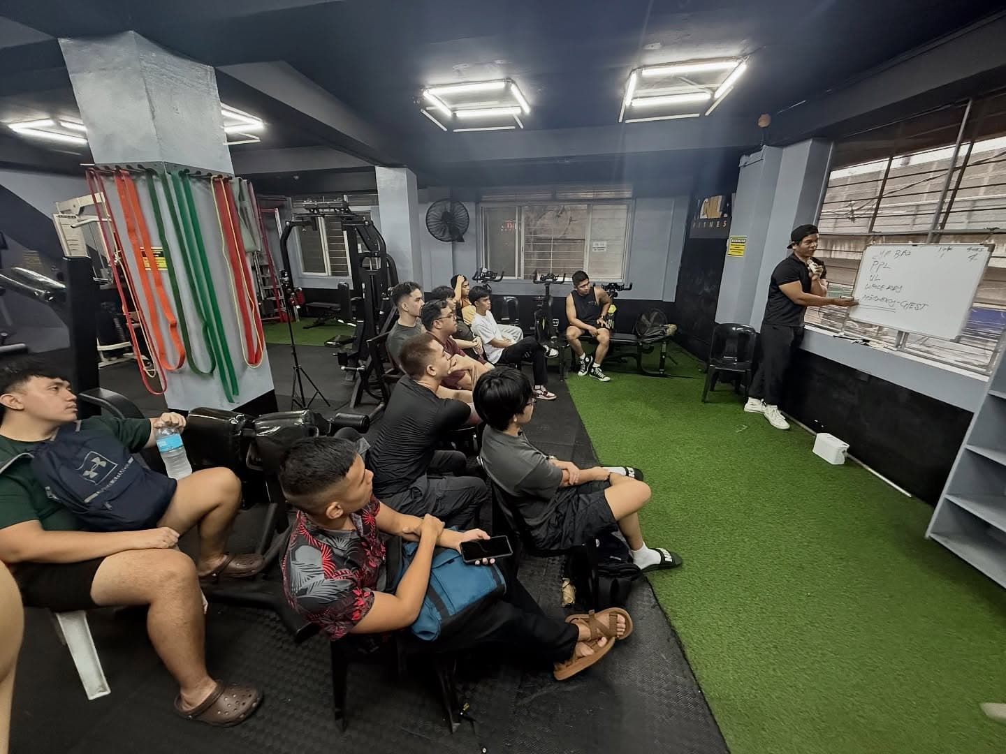 Members at a natural bodybuilding seminar inside MNLA Fitness